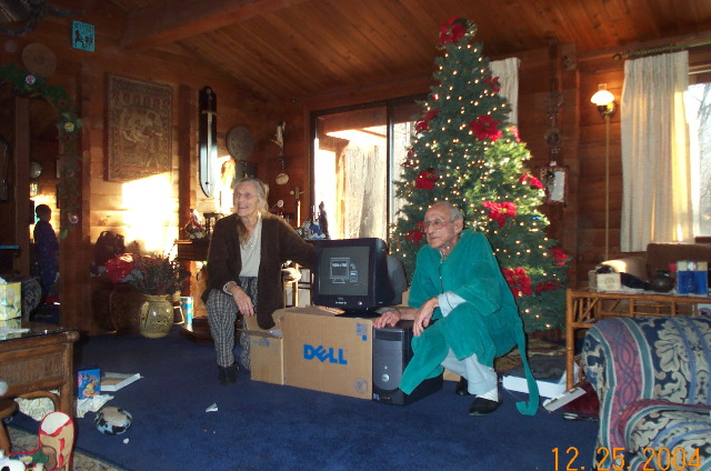 Peg & Bill with gift from all 3 sons